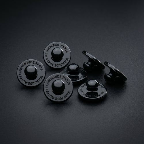 Breakaway Visor Pins for Fox Rampage, a set of six black pins on a dark surface.
