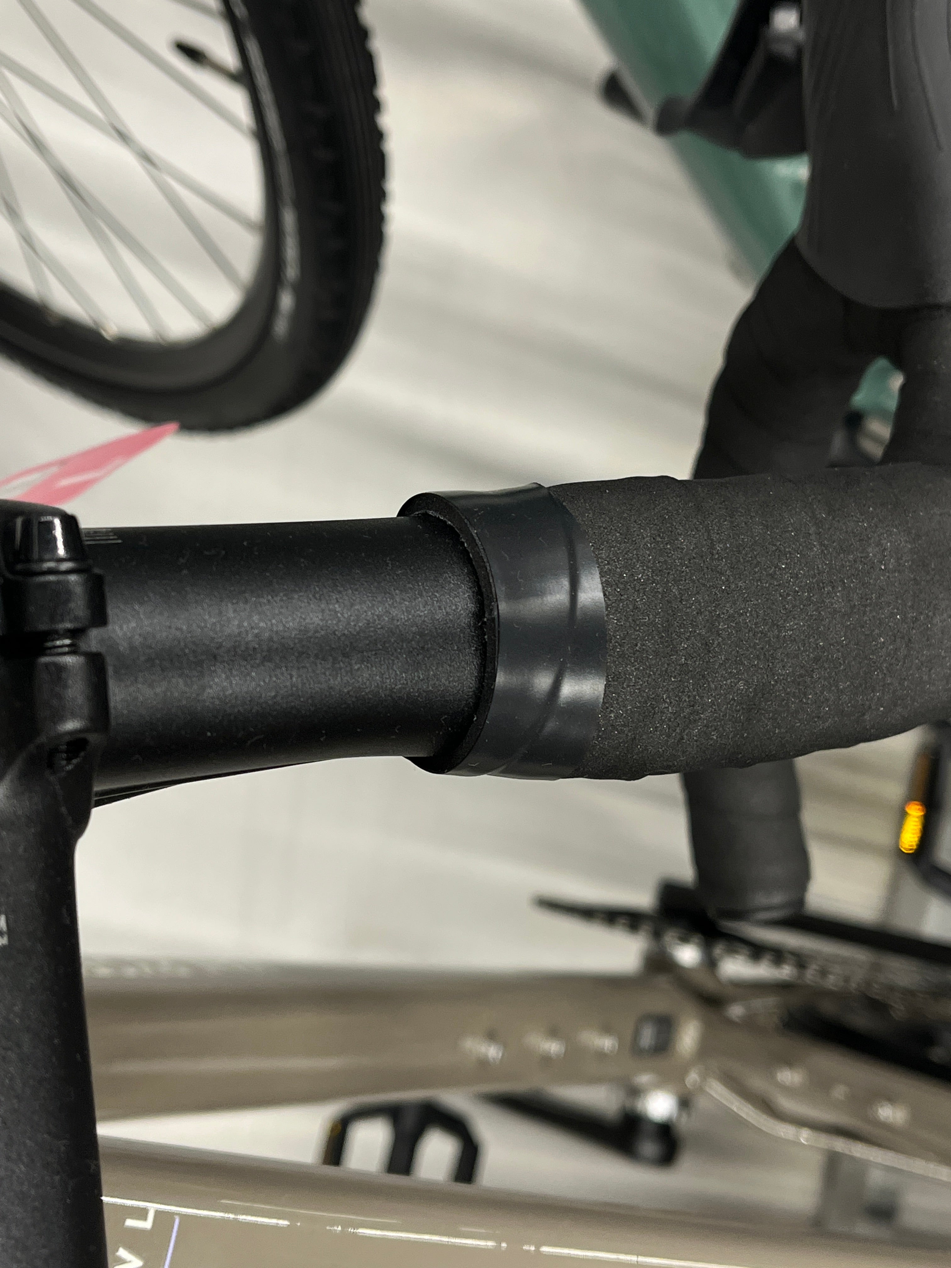 Untidy electrical tape finish where the bar tape ends on a new bike