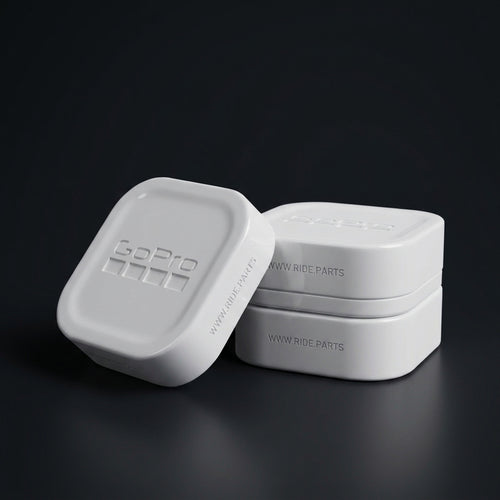 GoPro 13 Lens Covers in white, a cover and lens box set on a dark surface.