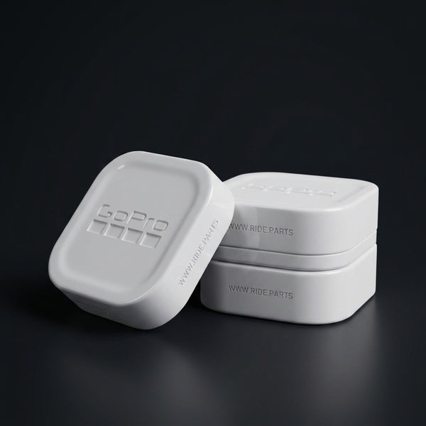 GoPro 13 Lens Covers in white, a cover and lens box set on a dark surface.