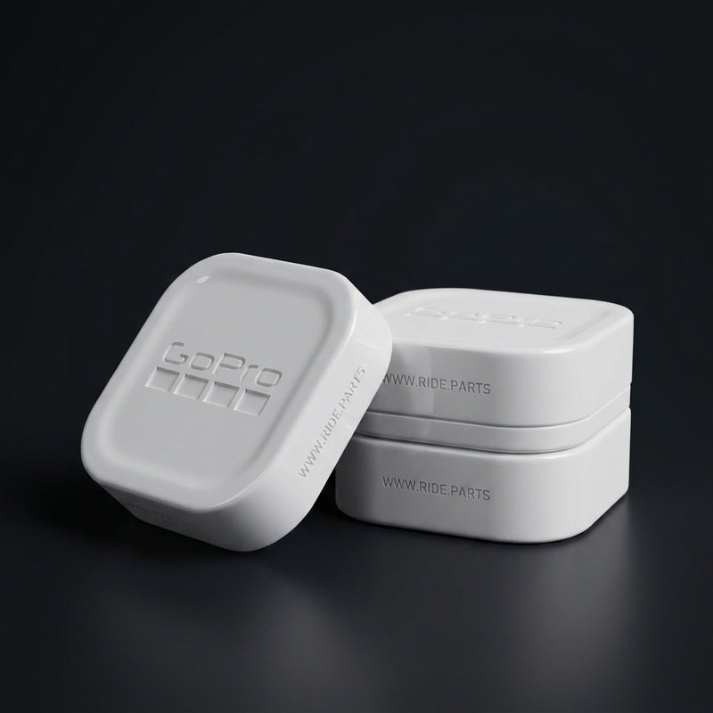 GoPro 13 Lens Covers in white, a cover and lens box set on a dark surface.