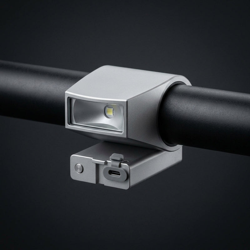 Low-Mount Crash-Safe Headlight in aluminium, clamped under a black handlebar.