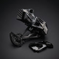 SRAM Derailleur Cover in black polished next to a SRAM GX Eagle derailleur