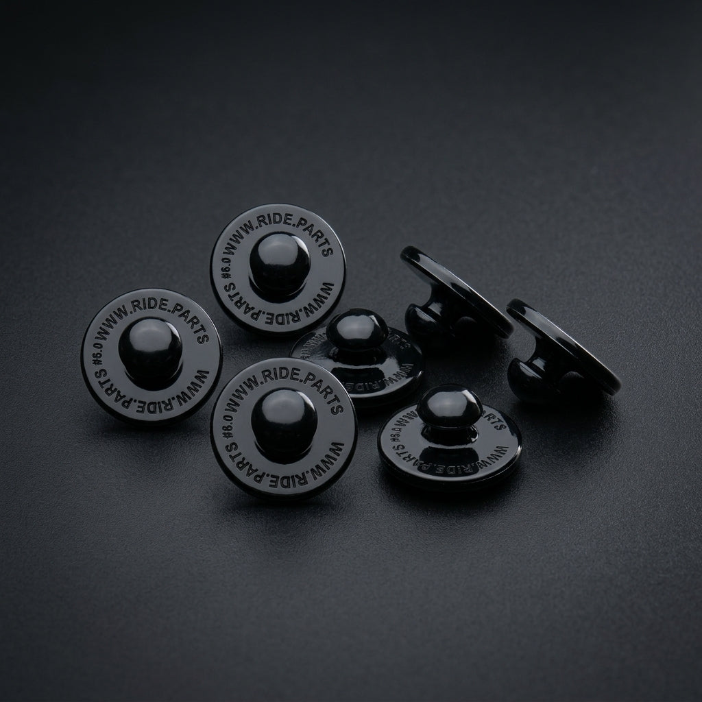 Breakaway Visor Pins for Fox Rampage, a set of six black pins on a dark surface.
