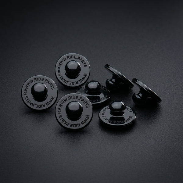 Breakaway Visor Pins for Fox Rampage, a set of six black pins on a dark surface.