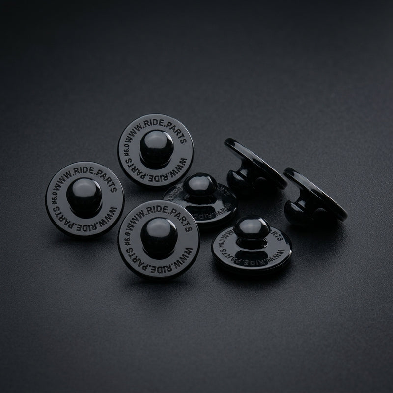 Breakaway Visor Pins for Fox Rampage, a set of six black pins on a dark surface.