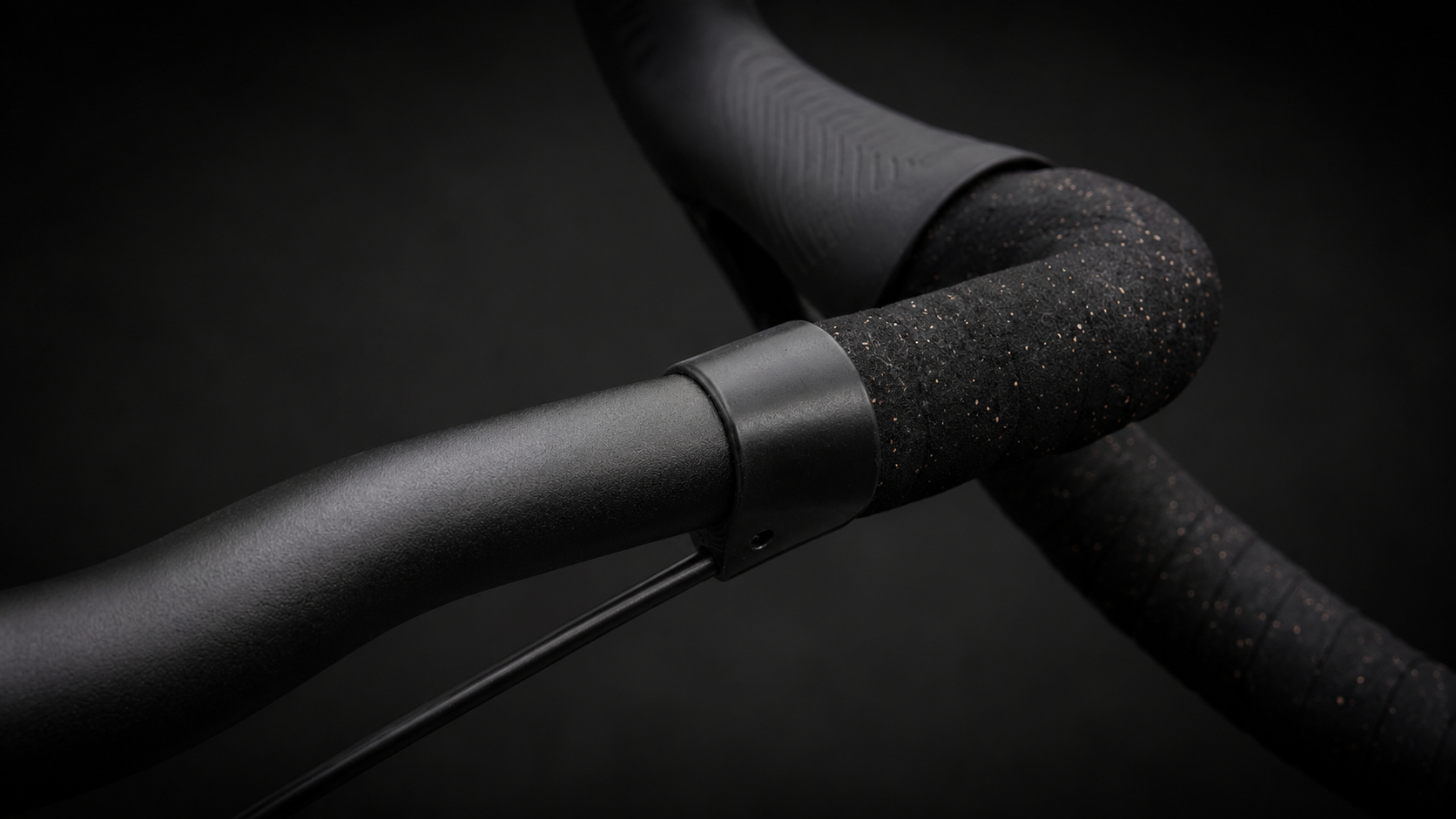 Close-up of the Wrap Clamp in black matte where the bar tape ends