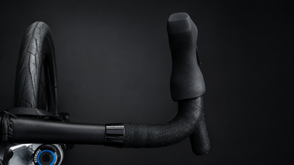 Wrap Clamp in black polished on a road bike cockpit seen from the front
