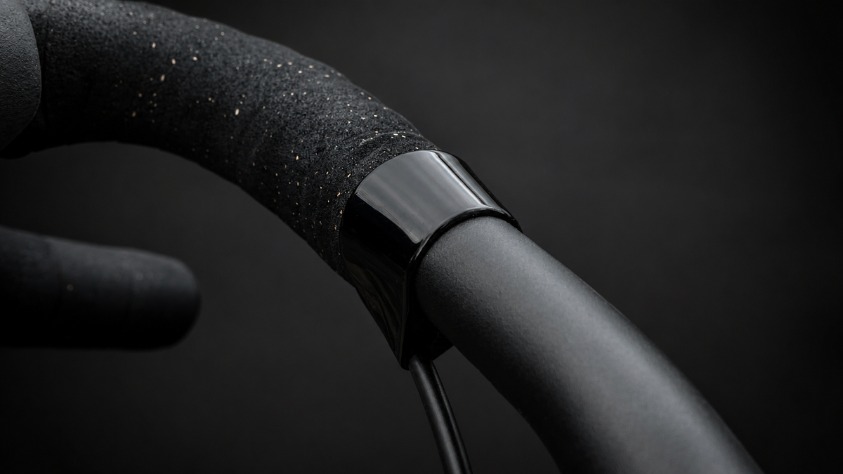 Close-up of the Wrap Clamp in black polished where the bar tape ends